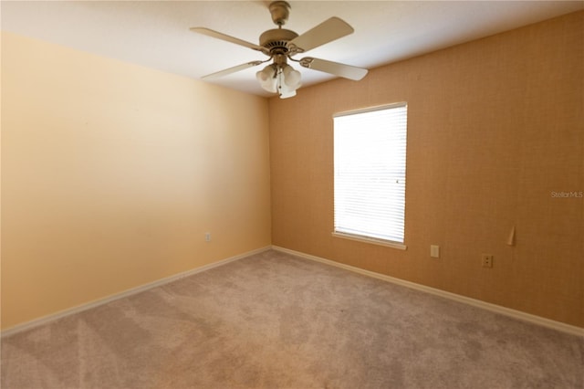 carpeted empty room with ceiling fan