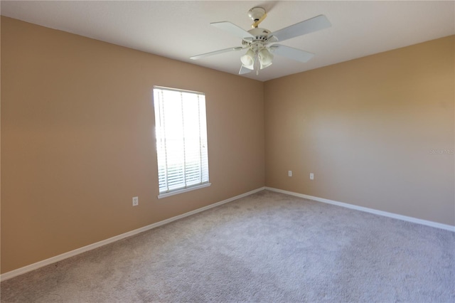 empty room featuring carpet flooring and ceiling fan