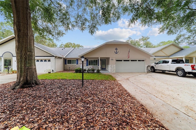 single story home featuring a garage and a front lawn