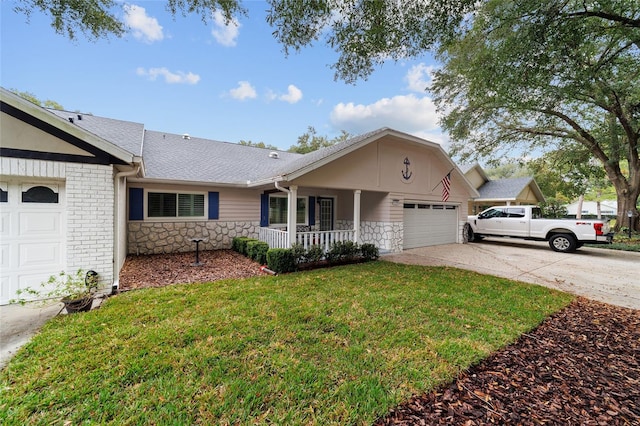 ranch-style house with a garage, a front lawn, and covered porch