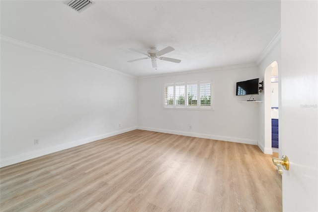 unfurnished room with ornamental molding, light hardwood / wood-style floors, and ceiling fan