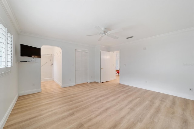 interior space with ceiling fan, light wood-type flooring, and crown molding