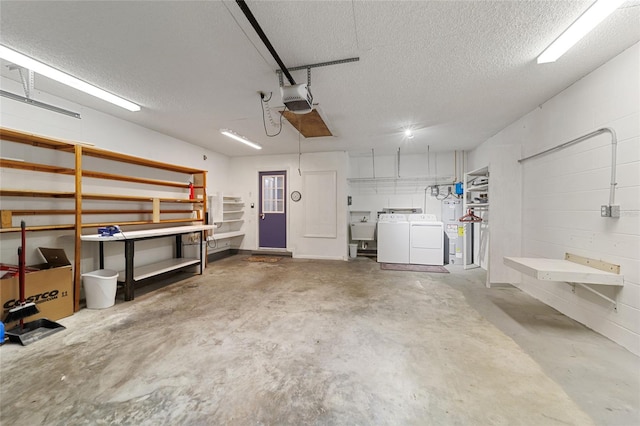 garage with washer and clothes dryer, sink, and a garage door opener