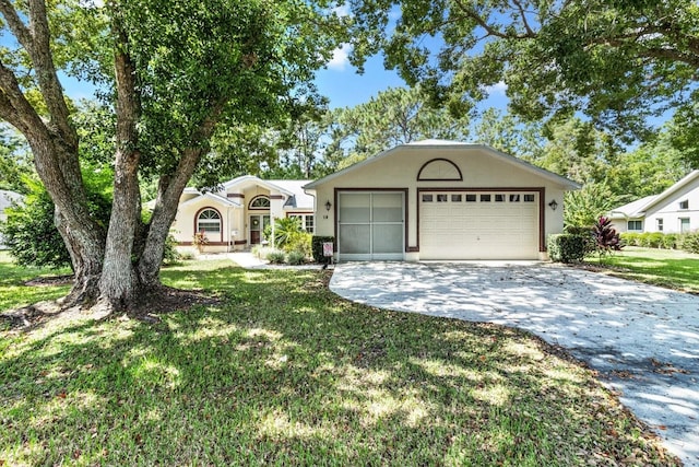 single story home with a garage and a front lawn