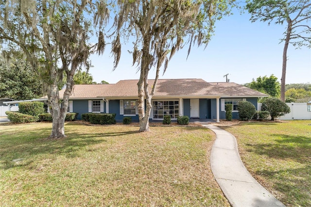 ranch-style house with a front lawn