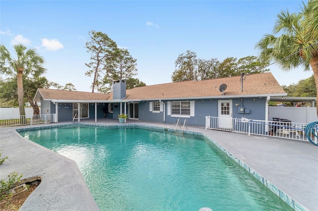 view of swimming pool with a patio