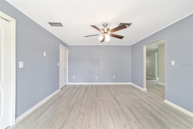 spare room with ceiling fan and light wood-type flooring