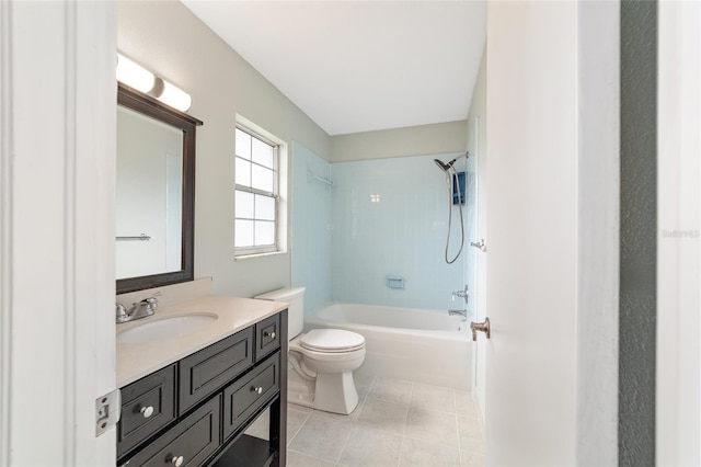 full bathroom with vanity, tile patterned floors, toilet, and tiled shower / bath