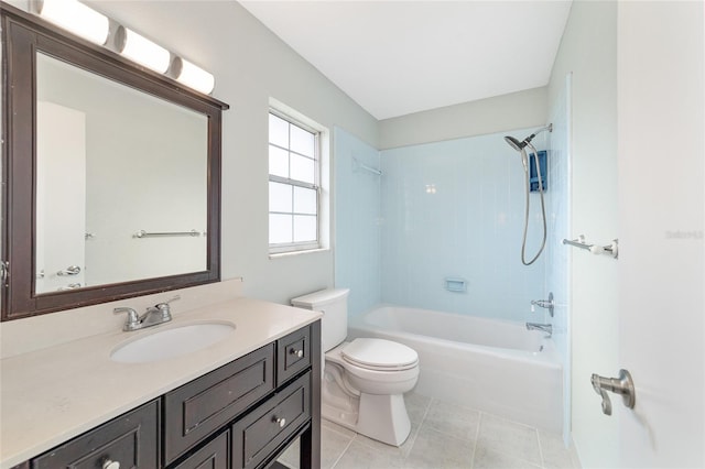 full bathroom featuring vanity, tile patterned floors, toilet, and tiled shower / bath combo