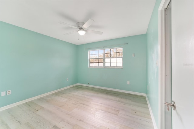 spare room featuring ceiling fan and light hardwood / wood-style flooring