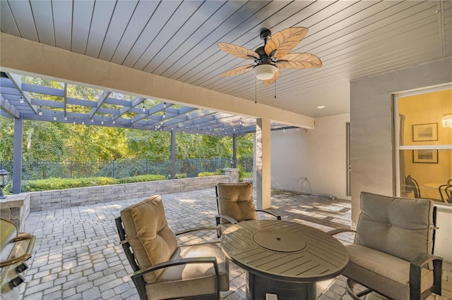 view of patio featuring ceiling fan and a pergola