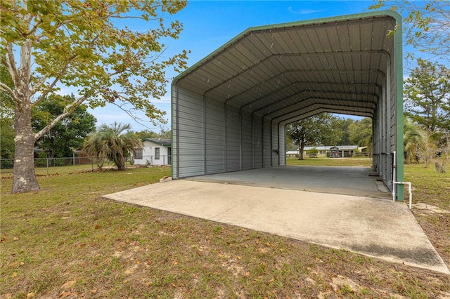 view of car parking with a yard and a carport