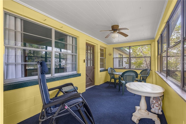 sunroom / solarium with ceiling fan