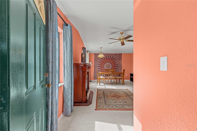 corridor with light tile patterned floors