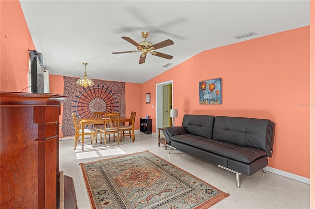 tiled living room featuring vaulted ceiling and ceiling fan