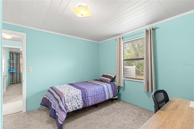 bedroom with light colored carpet, wood ceiling, and ornamental molding