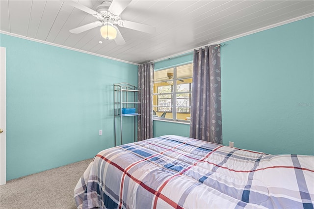 bedroom featuring ceiling fan, carpet flooring, and ornamental molding