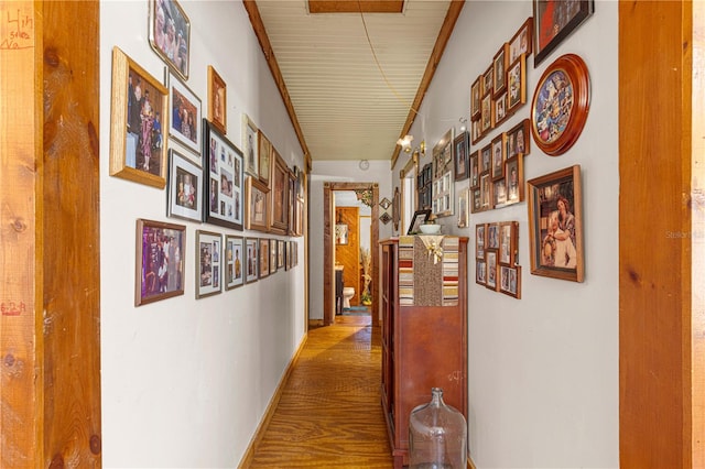 hallway with hardwood / wood-style floors, wood ceiling, and vaulted ceiling