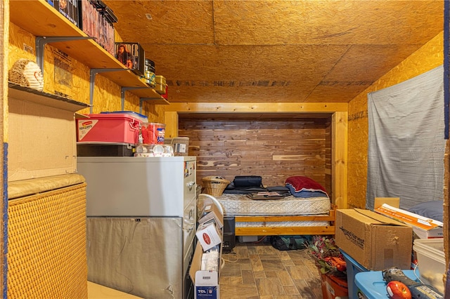 bedroom with wooden walls