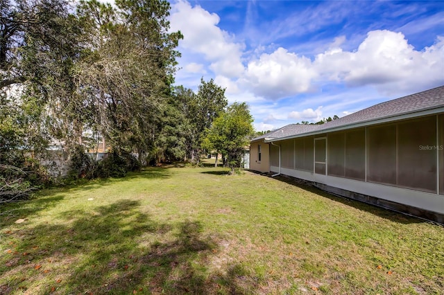 view of yard with a sunroom