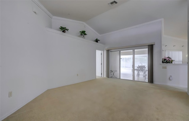 spare room featuring crown molding, carpet flooring, and lofted ceiling