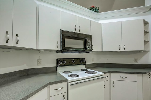 kitchen with white electric stove and white cabinetry