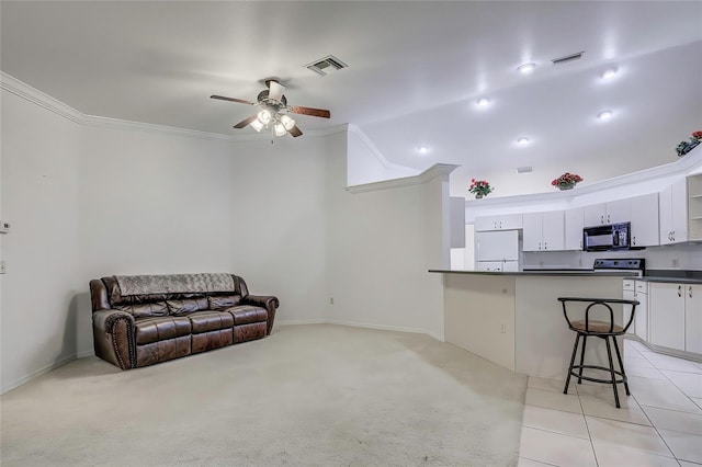 carpeted living room with ornamental molding and ceiling fan