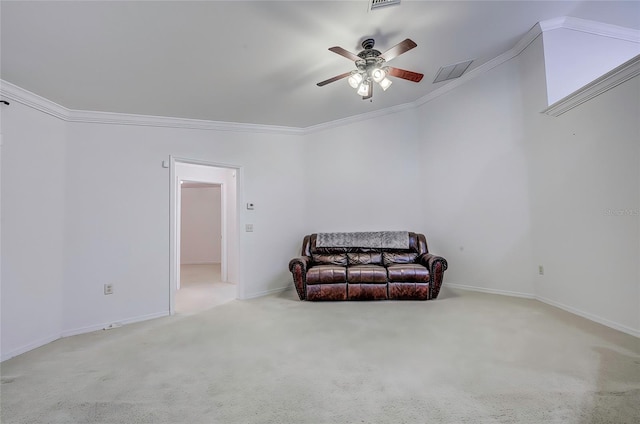 sitting room featuring ceiling fan, light colored carpet, and crown molding