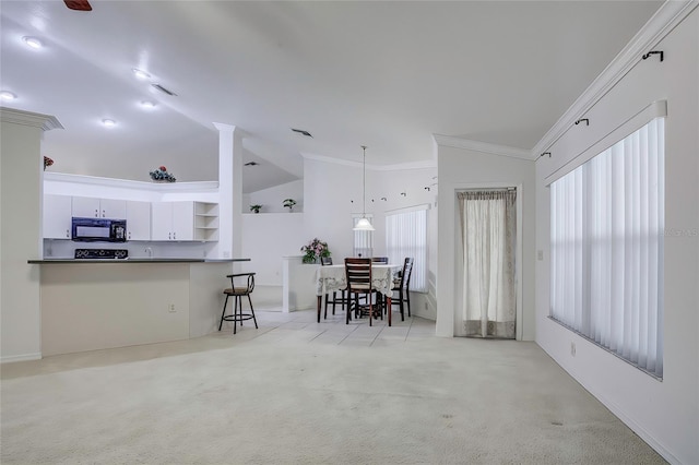 interior space with plenty of natural light, lofted ceiling, and crown molding