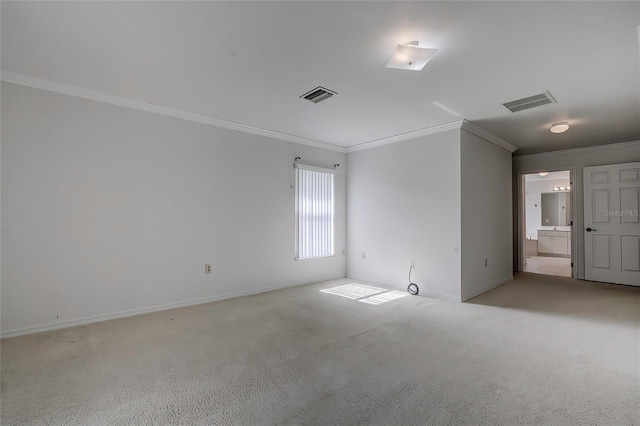 spare room featuring light carpet and ornamental molding