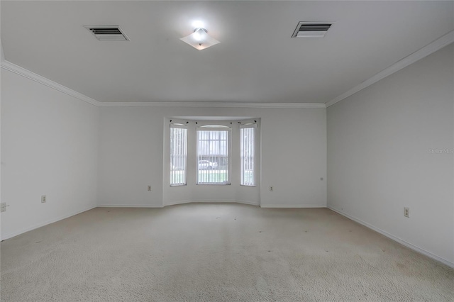 carpeted empty room with ornamental molding