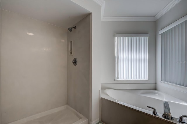 bathroom with shower with separate bathtub and ornamental molding