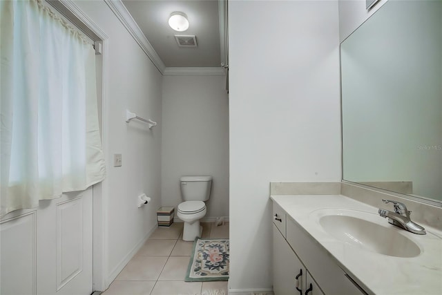 bathroom with vanity, tile patterned floors, toilet, and ornamental molding