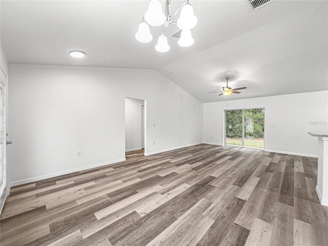 unfurnished living room featuring hardwood / wood-style floors, vaulted ceiling, and ceiling fan with notable chandelier