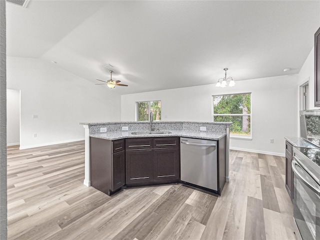 kitchen featuring light hardwood / wood-style floors, decorative light fixtures, a healthy amount of sunlight, and stainless steel appliances