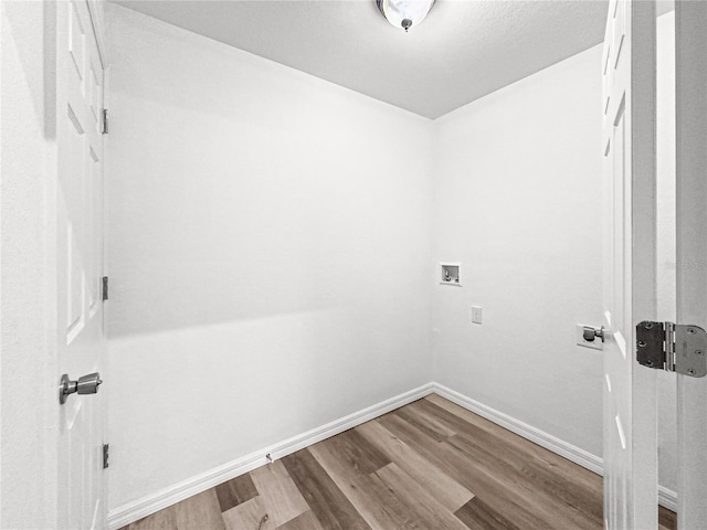 laundry room featuring hardwood / wood-style floors and washer hookup