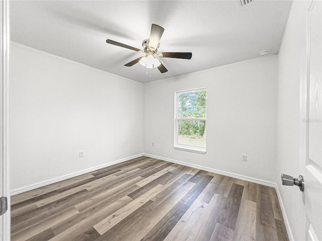 unfurnished room featuring hardwood / wood-style floors and ceiling fan