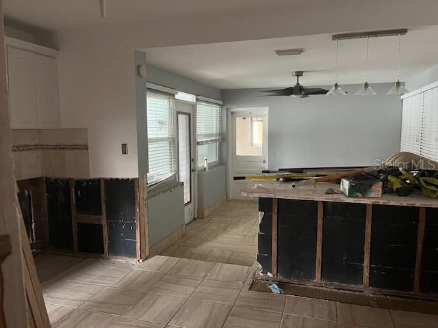 kitchen with hanging light fixtures and ceiling fan