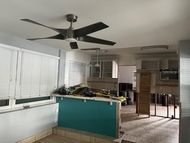 kitchen with light tile patterned flooring, ceiling fan, and green cabinetry