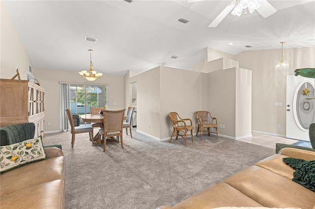 carpeted living room with ceiling fan with notable chandelier and lofted ceiling