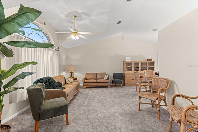 living room featuring lofted ceiling, light carpet, and ceiling fan