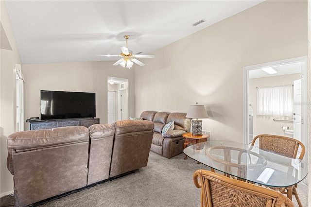 living room with lofted ceiling, carpet flooring, and ceiling fan