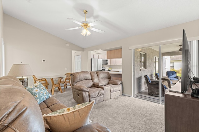 living room with lofted ceiling, light carpet, and ceiling fan