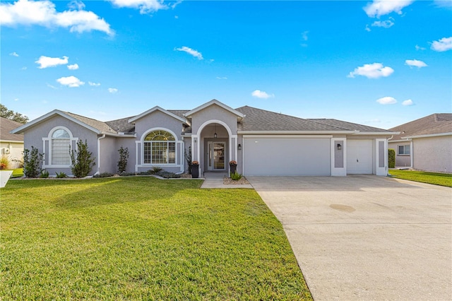 ranch-style home with a garage and a front yard