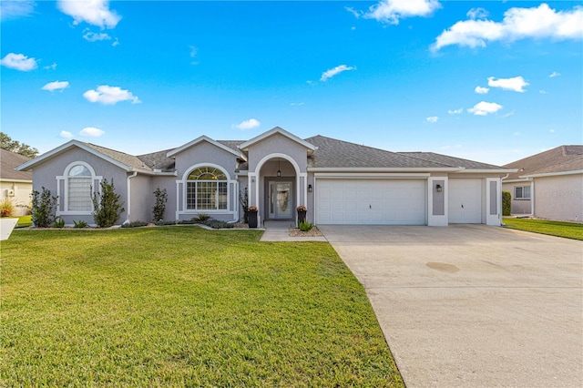 ranch-style home featuring a garage and a front yard