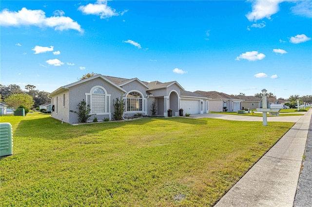 ranch-style house with a garage and a front yard