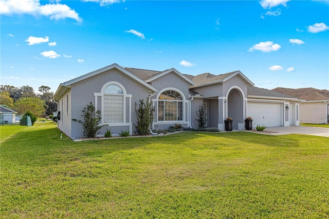 ranch-style house with a garage and a front yard