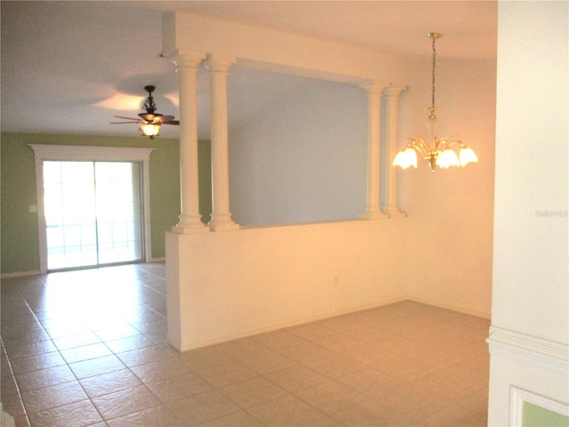 empty room featuring ceiling fan with notable chandelier and tile patterned flooring