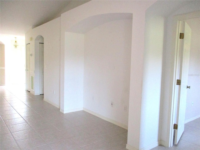 unfurnished room with light tile patterned floors