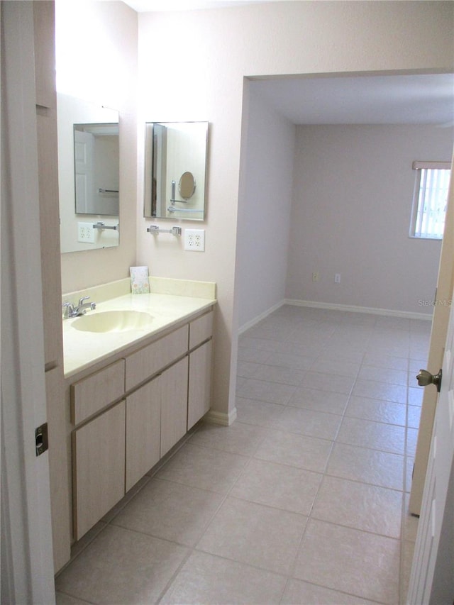 bathroom with vanity and tile patterned flooring